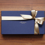 こちらは<a style="text-decoration: underline; font-weight: bold;" href="https://munekawa.jp/collections/longwallet">長財布</a>のラッピングです。<br>※アイテムごとのラッピング仕様は、各商品ページをご確認ください。